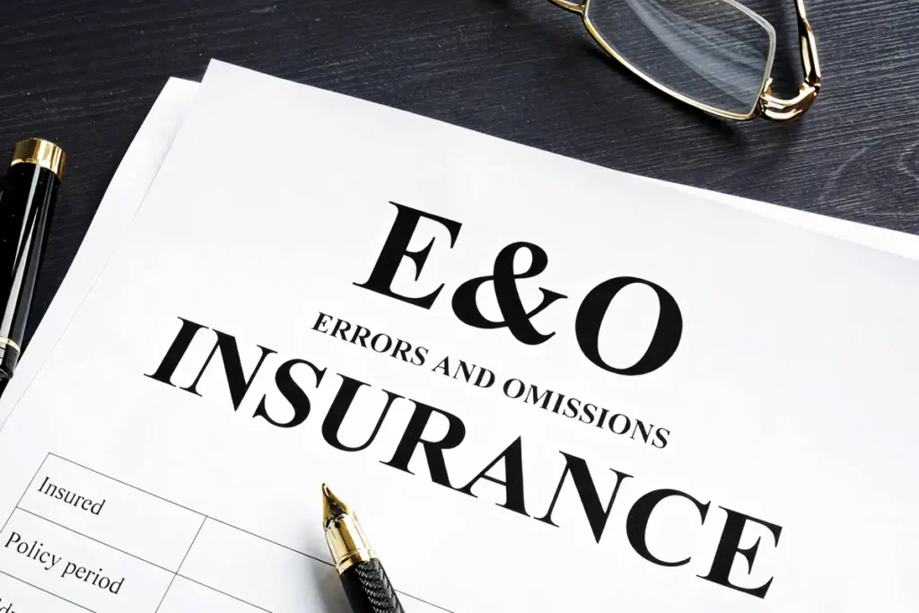 Business professional comparing Errors and Omissions insurance policies, evaluating coverage options beyond price and premiums